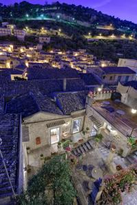 an aerial view of a city at night at Edel Modica in Modica