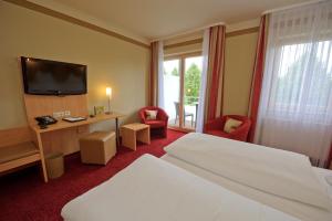 Postel nebo postele na pokoji v ubytování Land-gut-Hotel Hotel Adlerbräu