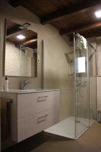 a bathroom with a glass shower and a sink at Casa sierra ferrera in Samper +31 photos