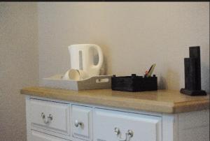 a counter top with a box and items on it at The Huntingdon in Dumfries