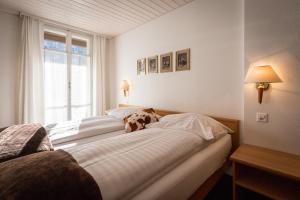 Ένα ή περισσότερα κρεβάτια σε δωμάτιο στο Hotel Oberland