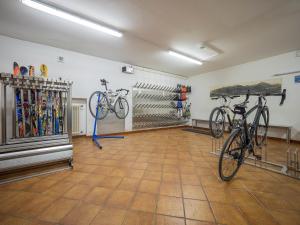 a room with two bikes parked in it at Hotel Baita della Luna in Livigno