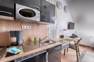 Kuchyň nebo kuchyňský kout v ubytování Pension Weinsberger Tal