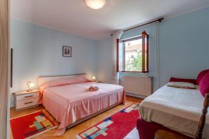 Postel nebo postele na pokoji v ubytování Apartment Marisa
