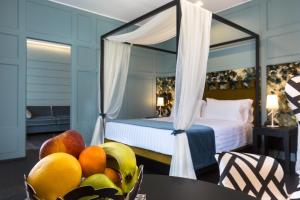 Voodi või voodid majutusasutuse Stendhal Luxury Suites toas