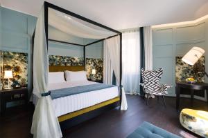 Säng eller sängar i ett rum på Stendhal Luxury Suites