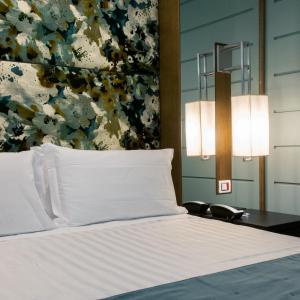 Voodi või voodid majutusasutuse Stendhal Luxury Suites toas