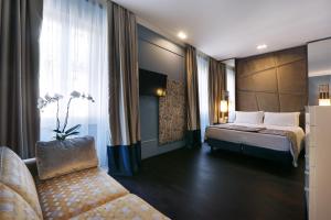 Voodi või voodid majutusasutuse Stendhal Luxury Suites toas