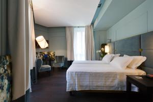 Voodi või voodid majutusasutuse Stendhal Luxury Suites toas
