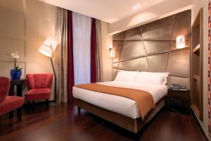 Voodi või voodid majutusasutuse Stendhal Luxury Suites toas
