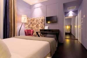 Voodi või voodid majutusasutuse Stendhal Luxury Suites toas
