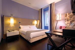 Voodi või voodid majutusasutuse Stendhal Luxury Suites toas