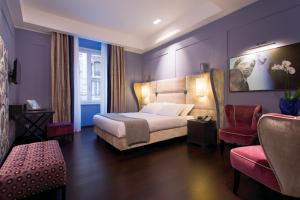 Voodi või voodid majutusasutuse Stendhal Luxury Suites toas