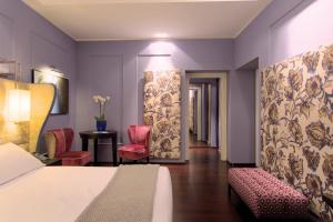 Voodi või voodid majutusasutuse Stendhal Luxury Suites toas
