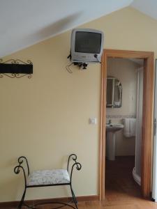 TV a/nebo společenská místnost v ubytování Casa Os Batans