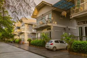a car parked in front of a building at Muaan Resort in Suphan Buri +47 photos