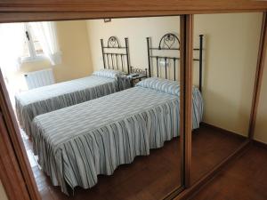 Postel nebo postele na pokoji v ubytování Casa Os Batans