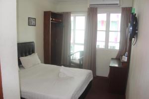 Postel nebo postele na pokoji v ubytování Alonto Hotel