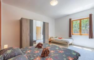 a bedroom with a teddy bear laying on a bed at Apartments Klaudija in Pula +47 photos