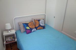 Postel nebo postele na pokoji v ubytování Lisbon Beach Apartments 2