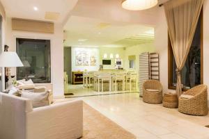 a living room with a couch and a dining room at Kalá Hotel Boutique in Punta del Este