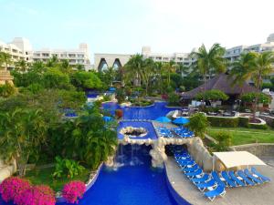an aerial view of a resort pool with chairs and water slide at Barceló Karmina - All Inclusive in Manzanillo
