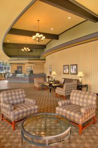 a lobby with couches and a coffee table in a room at Red Lion Hotel Coos Bay in Coos Bay