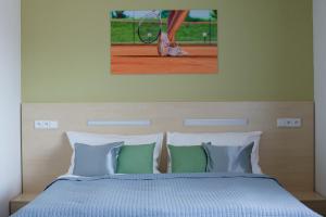 Postel nebo postele na pokoji v ubytování Penzion Tenis HTK