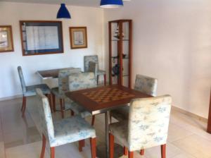 a dining room with a table and chairs at Departamento Viana in Viña del Mar