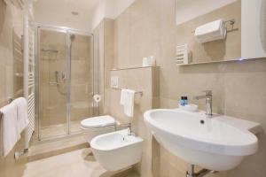 a bathroom with a sink and a toilet and a shower at Albergo Teresa in Laigueglia +58 photos