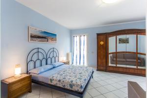 A bed or beds in a room at Residence Kimba