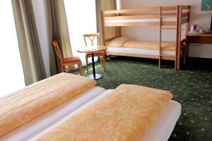 Letto o letti in una camera di Hotel Eigerblick
