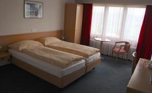 Letto o letti in una camera di Hotel Eigerblick