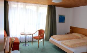 Letto o letti in una camera di Hotel Eigerblick