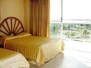 Postel nebo postele na pokoji v ubytování Salvia Cancun Aparts
