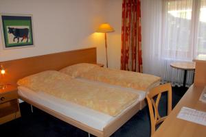 Letto o letti in una camera di Hotel Eigerblick