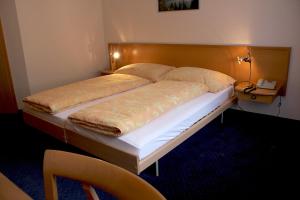 Letto o letti in una camera di Hotel Eigerblick