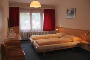 Letto o letti in una camera di Hotel Eigerblick