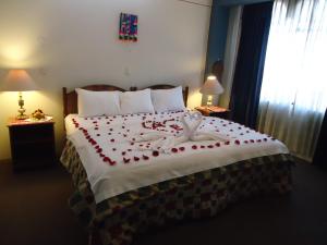 Postel nebo postele na pokoji v ubytování Hotel T'ika
