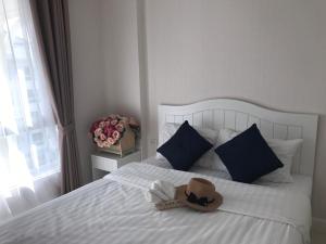 Postel nebo postele na pokoji v ubytování The Energy Hua Hin by Jammaree