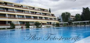 a large swimming pool in front of a building at Listen THE VIEWS - 223 in Costa Del Silencio