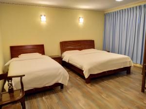 Postel nebo postele na pokoji v ubytování Uncle Ho Motel + 14 fotografií