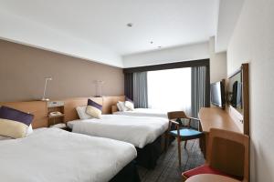 Letto o letti in una camera di Hotel Granvia Hiroshima
