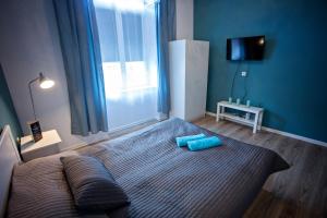 Posteľ alebo postele v izbe v ubytovaní Apartamenty Nowy Rynek