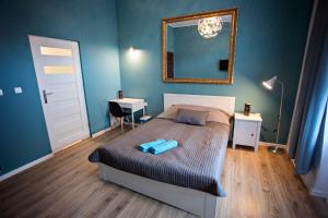 Posteľ alebo postele v izbe v ubytovaní Apartamenty Nowy Rynek
