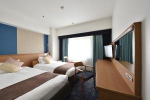Letto o letti in una camera di Hotel Granvia Hiroshima