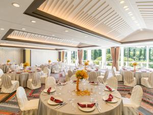 a banquet hall with white tables and white chairs at Sheraton Okinawa Sunmarina Resort in Onna +37 photos