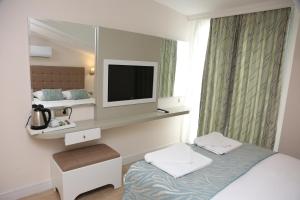 Кровать или кровати в номере Asli Hotel