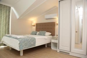 Кровать или кровати в номере Asli Hotel