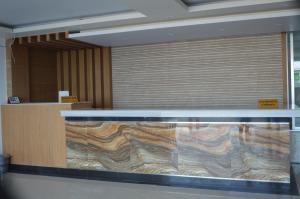 a large aquarium in the middle of a room at Well Park Resort in Cox's Bazar